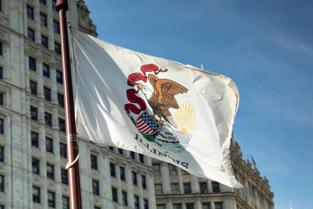 Illinois state flag waves in the city of Chicago in front of the Wrigley Building, Illinois USA